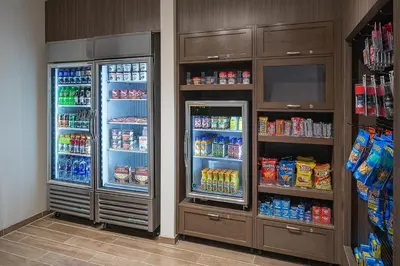 two refrigerators in a room with food and drinks at Residence Inn by Marriott Ontario Rancho Cucamonga in Rancho Cucamonga