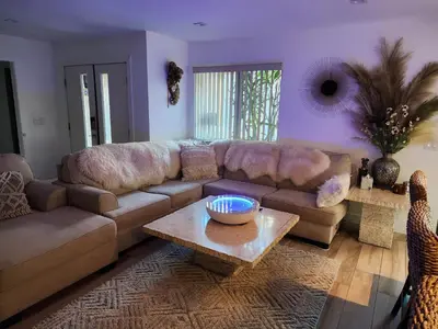 a living room with a couch and a table at Heaven's Best Kept Secret 4 Min From The Sea in Pacific Palisades