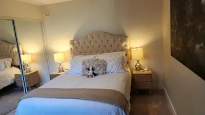 a teddy bear sitting on a bed in a bedroom at Heaven's Best Kept Secret 4 Min From The Sea in Pacific Palisades