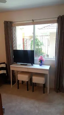 a desk with a computer on it with a window at Heaven's Best Kept Secret 4 Min From The Sea in Pacific Palisades