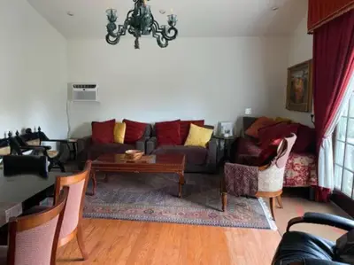 a living room with a couch and a table at Entire Second Flr - Santa Monica Luxury Roman Villa in Los Angeles