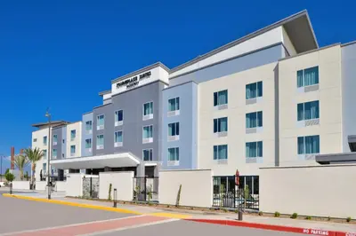 a white hotel building with a blue sky at TownePlace Suites by Marriott Ontario Chino Hills in Chino Hills