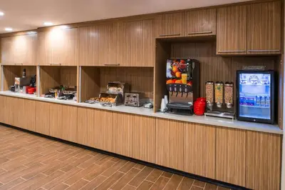 a lobby with a cafeteria with a food counter at TownePlace Suites by Marriott Ontario Chino Hills in Chino Hills