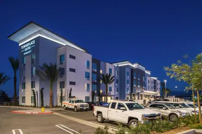 a large building with cars parked in a parking lot at TownePlace Suites by Marriott Ontario Chino Hills in Chino Hills