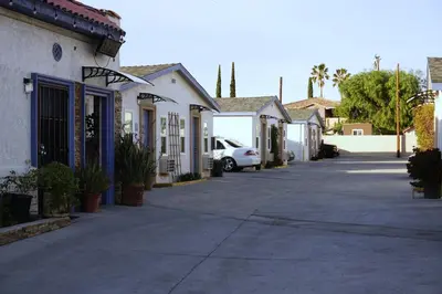 a street of houses with a car parked on the street at Route 66 Motel - Rialto in Rialto