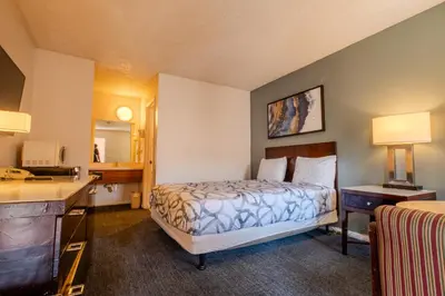 a hotel room with a bed and a desk at National 9 Inns in Buttonwillow