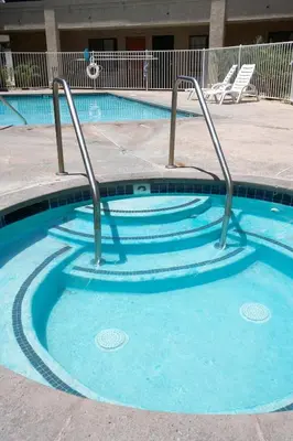 a small swimming pool with stairs in a building at Premier Inns Thousand Oaks in Thousand Oaks