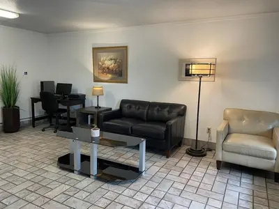 a living room with a couch and a table at Premier Inns Thousand Oaks in Thousand Oaks
