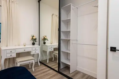a dressing room with a mirror and a desk at Regency Modern Apartments in Glendale