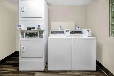 two white refrigerators sitting next to each other in a room at La Quinta by Wyndham Anaheim in Anaheim
