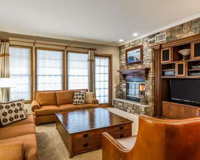 a living room with a couch and a table at Bluegreen Vacations Big Bear Village, an Ascend Collection Resort in Big Bear Lake
