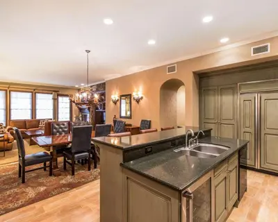 a kitchen with a sink and a dining room at Bluegreen Vacations Big Bear Village, an Ascend Collection Resort in Big Bear Lake