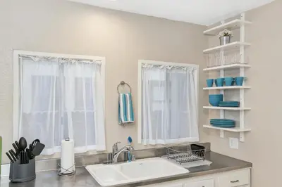 a kitchen with a sink and a window at Long Beach House in Long Beach