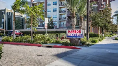 a sign that says harbor motel in front of a building at Harbor Motel in Anaheim