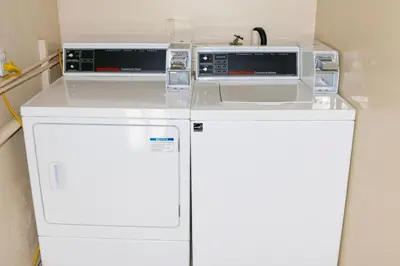 two appliances are sitting on top of a refrigerator at Budget Inn On Historic Route 66, Barstow in Barstow