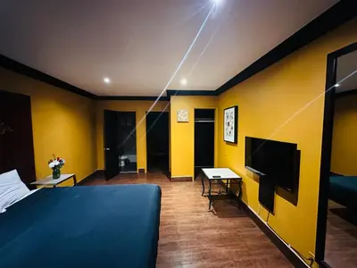 a hotel room with a bed and a television at Casa Blanca Inn - Whittier, Los Angeles in Whittier