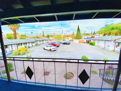 a view of a parking lot from a balcony at Casa Blanca Inn - Whittier, Los Angeles in Whittier
