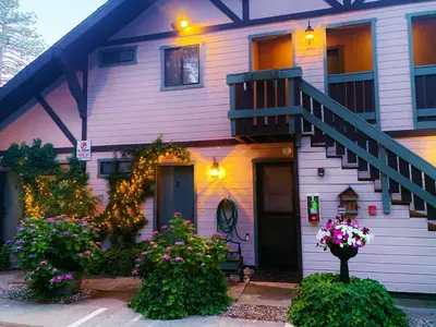 a house with flowers in front of it at The North Shore Inn in Crestline
