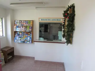 a store front with a christmas wreath on the wall at Welcome Inn & Suites Anaheim in Anaheim