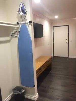 a room with a surfboard hanging on a wall at Welcome Inn & Suites Anaheim in Anaheim