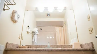a bathroom with a sink and a mirror at Motel 6 - Anaheim Hills, CA in Anaheim