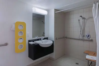 a bathroom with a sink and a mirror at Studio 6-Barstow, CA in Barstow