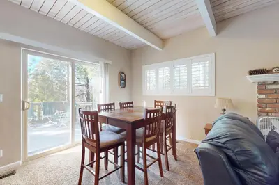 a dining room with a table and chairs at Dancing Bear Chalet in Lake Arrowhead