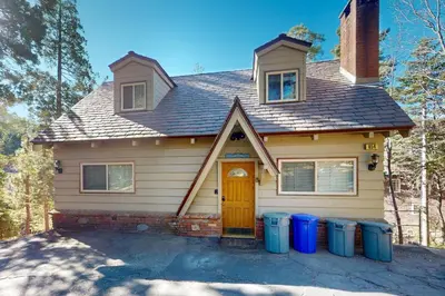 a house with trash cans in front of it at Dancing Bear Chalet in Lake Arrowhead
