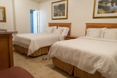 a bedroom with two beds and a window at Casa Del Sol in Carpinteria