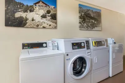 two washing machines and a washer and dryer in a room at SureStay Plus Hotel by Best Western Upland - Ontario North in Upland