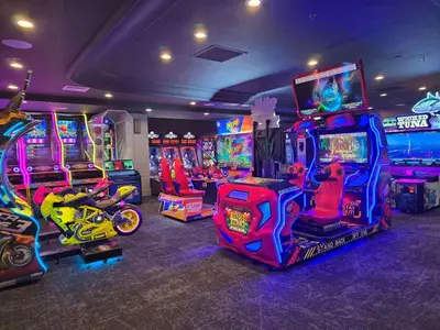 a room with arcade games and video game machines at Embassy Suites by Hilton Anaheim North in Anaheim