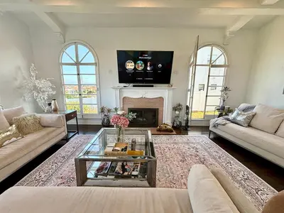 a living room with a couch and a fireplace at SpanishFairytale4bd3ba in San Pedro