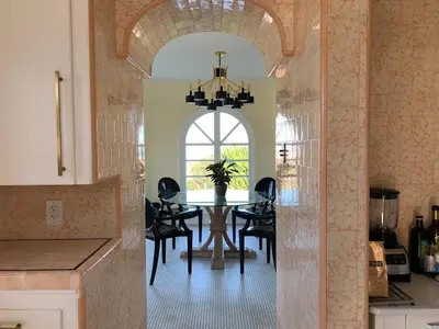 a kitchen and dining room with a table and chairs at SpanishFairytale4bd3ba in San Pedro