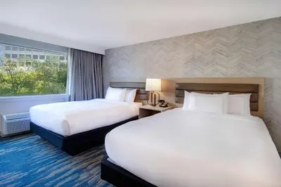 a hotel room with two beds and a window at DoubleTree by Hilton LAX - El Segundo in El Segundo
