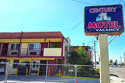 a sign for a motel in front of a building at Century Motel Buena Park Anaheim I-5 in Buena Park