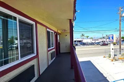 a side view of a building with a view of a street at Century Motel Buena Park Anaheim I-5 in Buena Park