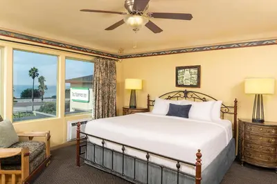 a bedroom with a bed and a window at The Pierpont Inn in Ventura