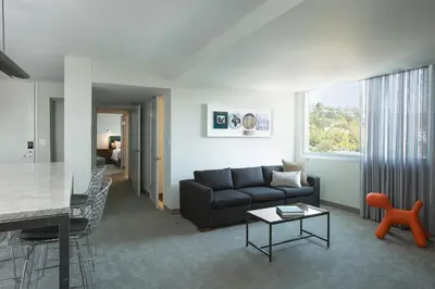 a living room with a couch and a table at Andaz West Hollywood, By Hyatt in Los Angeles