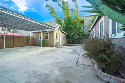 an empty parking lot in front of a house at Stylish 2 Bed & 2 Bath at the Heart of Hollywood with Free Parking - One Car only in Los Angeles
