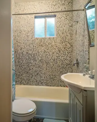 a bathroom with a tub and a sink and a toilet at Stylish 2 Bed & 2 Bath at the Heart of Hollywood with Free Parking - One Car only in Los Angeles