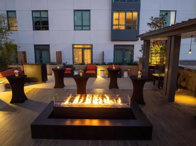 a courtyard with a fire fountain in front of a building at Hyatt Place Pasadena in Pasadena