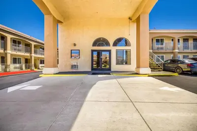 a parking lot in front of a large building at Quality Inn & Suites in Hesperia