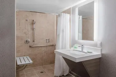 a bathroom with a sink and a shower at Holiday Inn La Mirada Buena Park by IHG in La Mirada