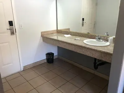 a bathroom with a sink and a mirror at Starlight Inn, Valley Blvd - Downtown LA in Los Angeles