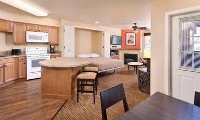 a kitchen and living room with a bed and a table at WorldMark Big Bear Lake in Big Bear Lake