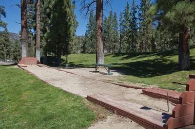 a park with a bench in a park with trees at WorldMark Big Bear Lake in Big Bear Lake
