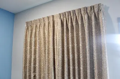 a curtain in a room with a wall at Crescent Inn in Wilmington