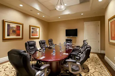 a conference room with a table and leather chairs at DoubleTree Suites By Hilton Anaheim Resort/Convention Center in Anaheim