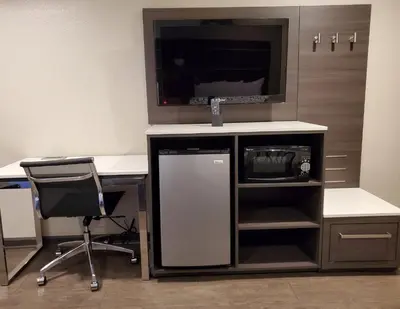 an office with a desk with a tv and a computer at Oak Park Motel in Monrovia