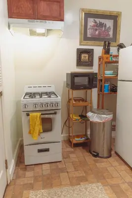 a kitchen with a stove and a refrigerator at Cozy private Guest House in Los Angeles